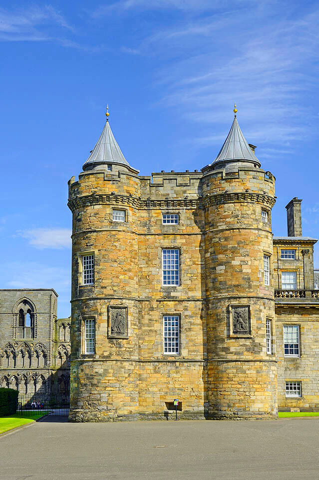 The Palace of Holyroodhouse in Edinburgh with the ruins of Holyrood Abbey