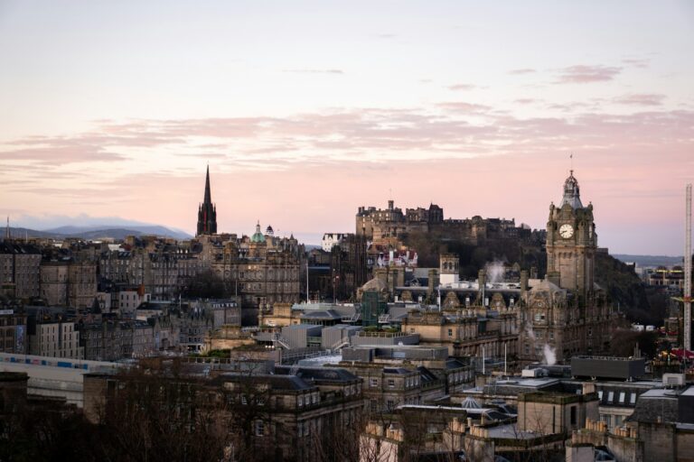 Edinburgh skyline at dawn with the Old Town spires still quiet before the day begins