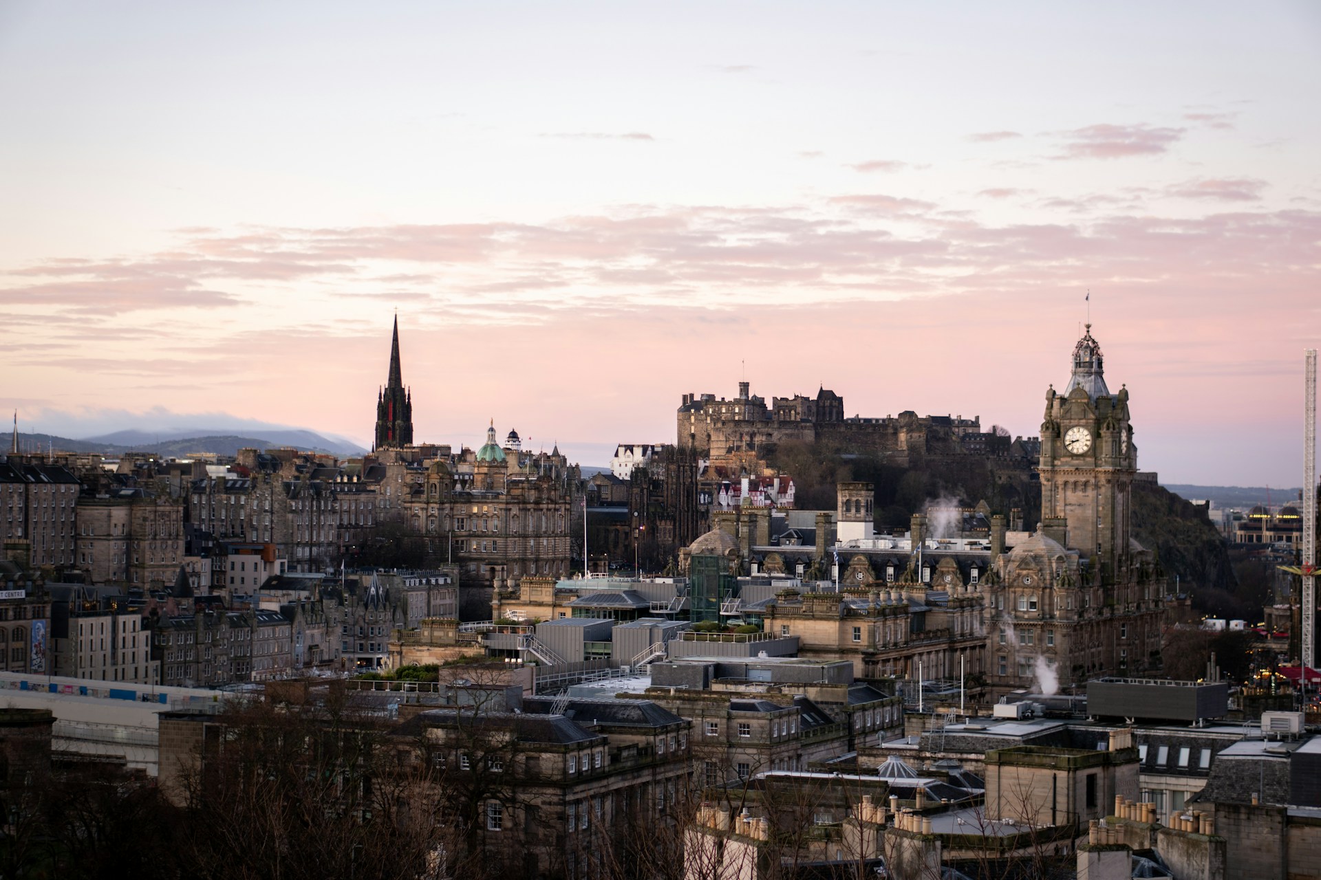 Edinburgh skyline at dawn with the Old Town spires still quiet before the day begins