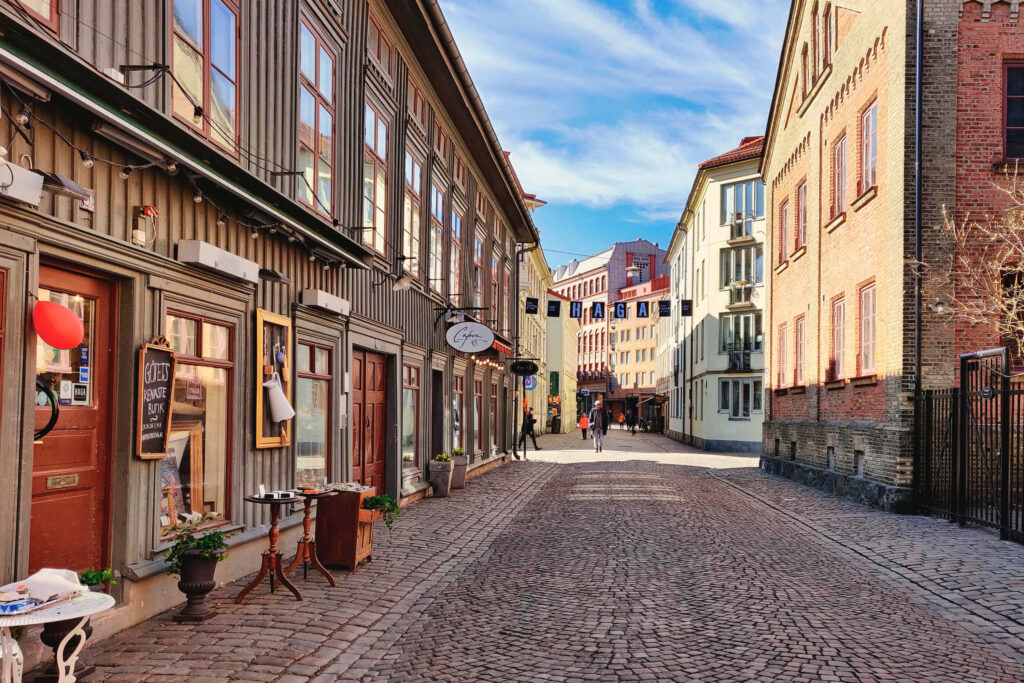 Cobblestone street with wooden landshövdingehus houses in Gothenburg's Haga district