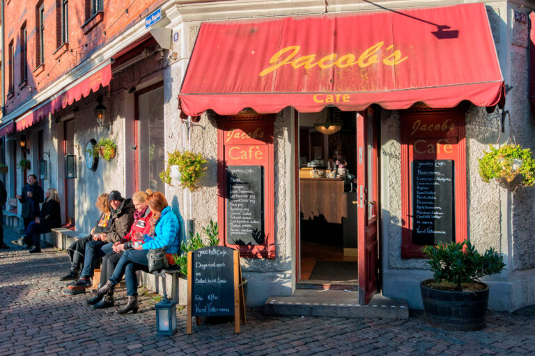 People enjoying fika outside a traditional café in Haga, Gothenburg
