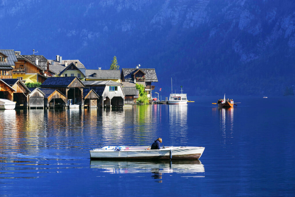 Lakeside boathouses in Hallstatt on a blue evening