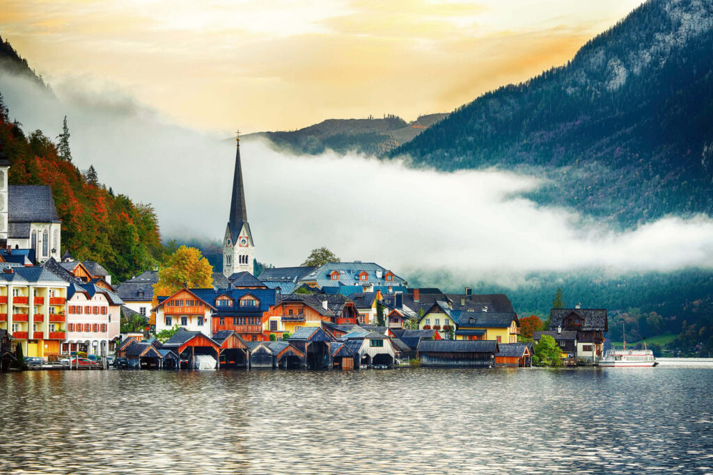 Hallstatt waterfront beneath low mountain clouds