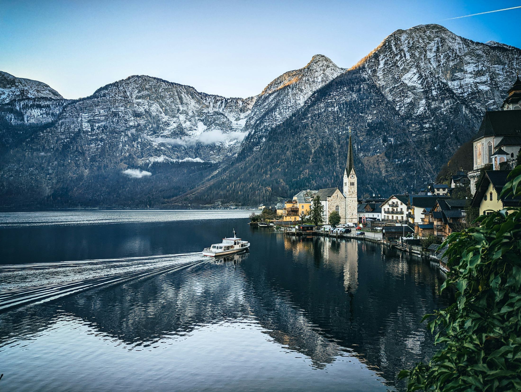 Passenger boat on Lake Hallstatt at dawn