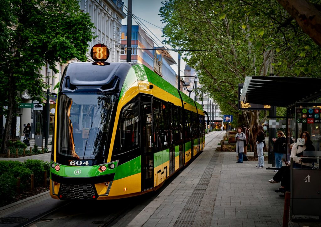 A modern tram on the airport line in Edinburgh's West End
