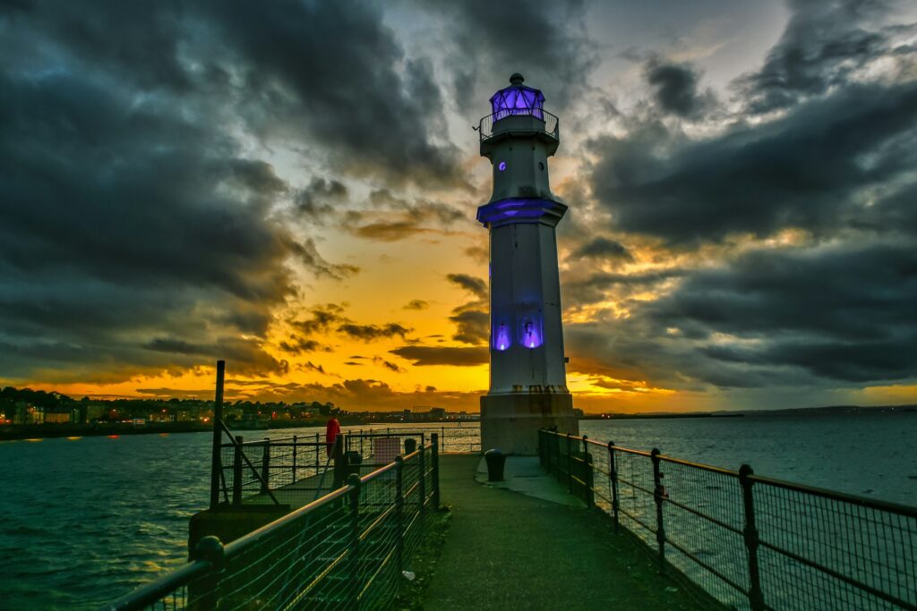 Newhaven lighthouse at sunset on the waterfront near Leith in Edinburgh