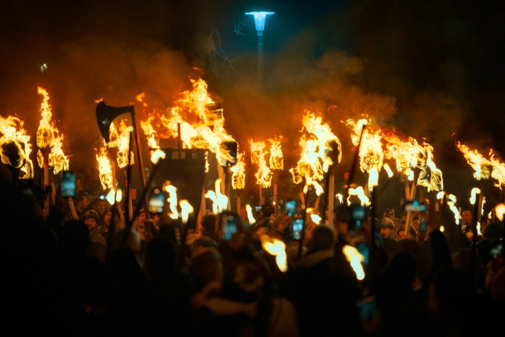 A torchlight procession through the streets of Edinburgh at night