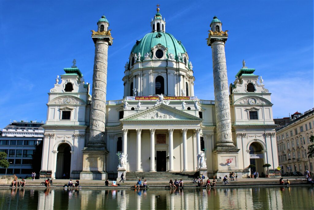 The dome and columns of the Karlskirche reflected in the pond on Karlsplatz in Vienna