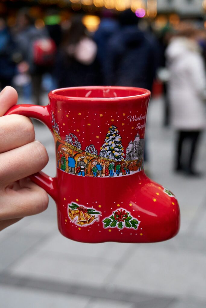 A steaming mug of mulled wine at a Vienna Christmas market stall