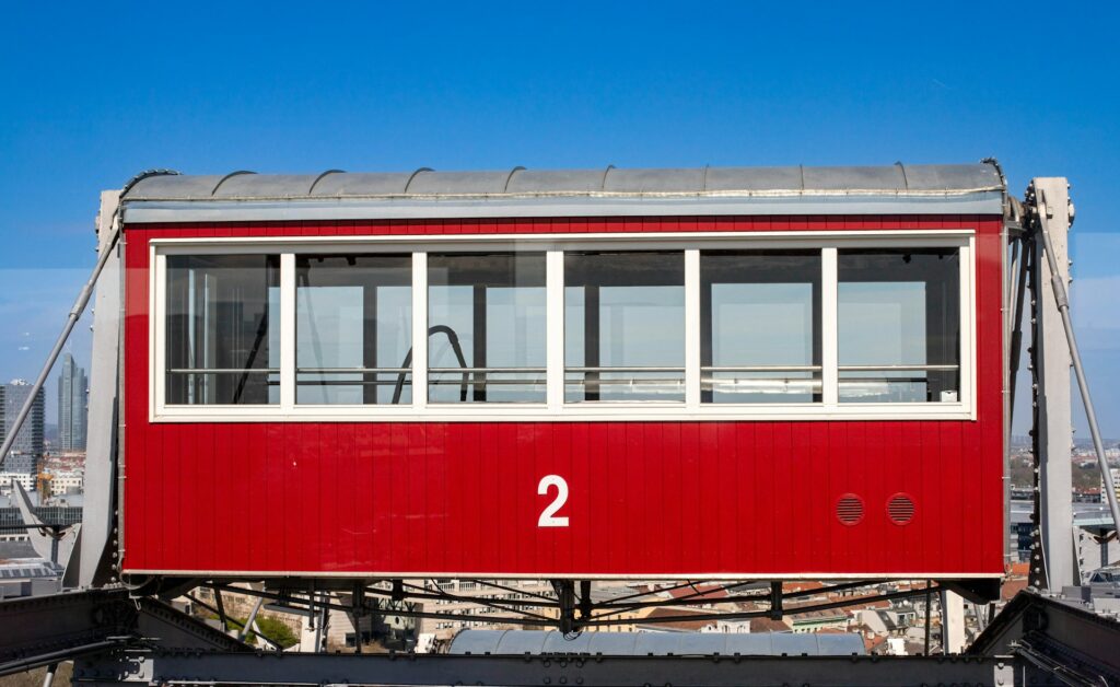 Red cabin of Vienna's Giant Ferris Wheel against the sky